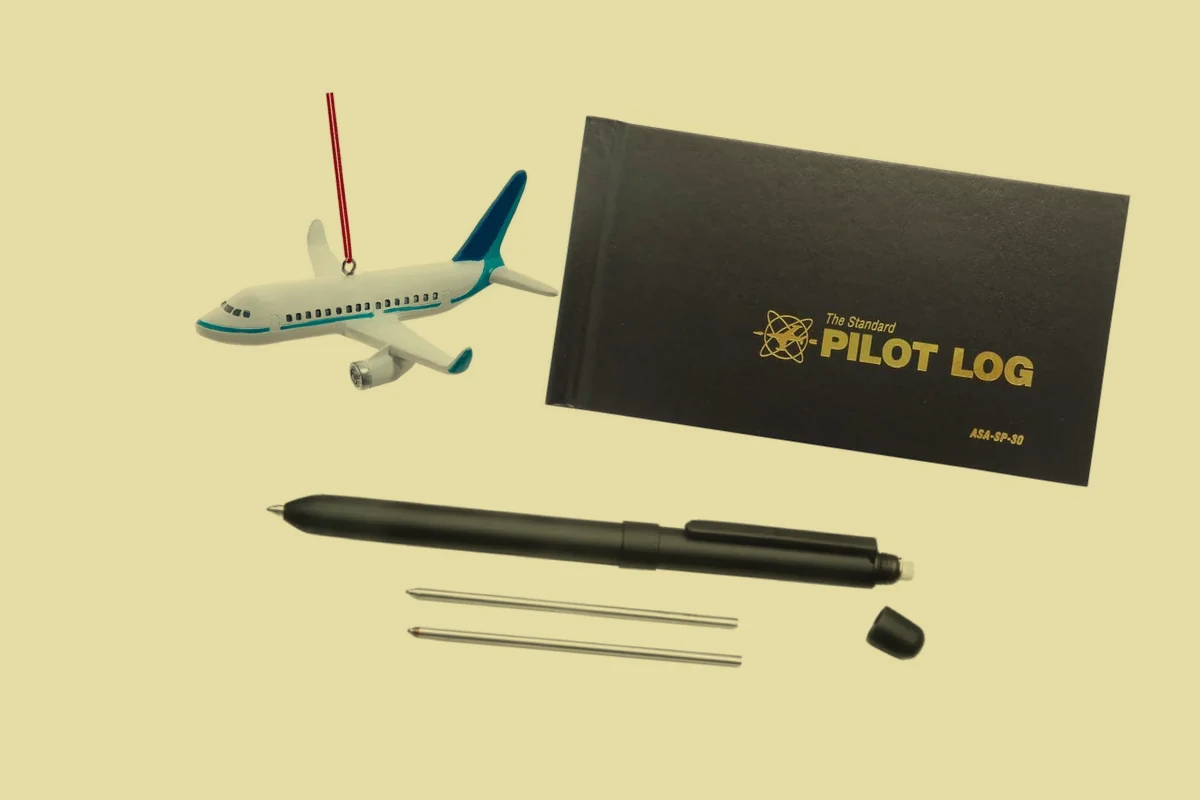 Kurt Adler Airliner Ornament, ASA pilot logbook, SKILCRAFT B3 Aviator pen